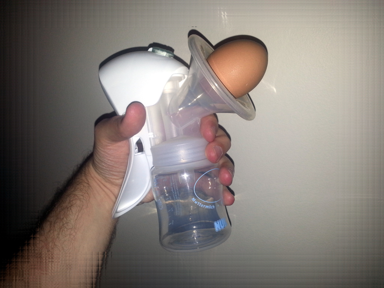 Breast pump sucking an egg